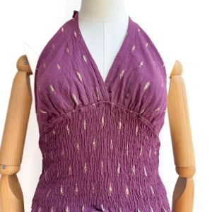 Conjunto halter de top smock y falda pantalón con detalles dorados